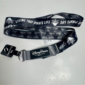 NWT. Disney Parks reversible pin lanyard with a "Pirates of the Caribbean"